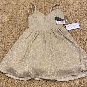 Glittery Gold short dress.